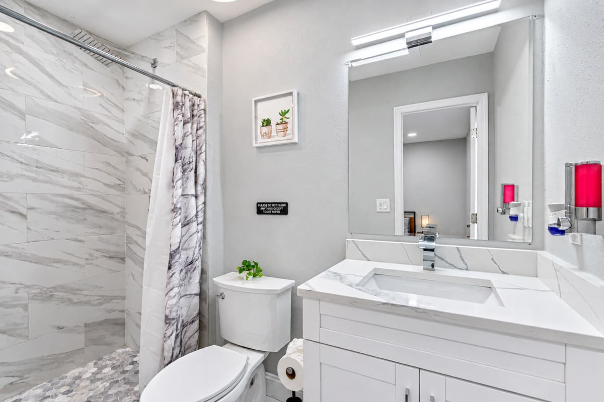 Beautiful bathroom equipped with a sink, toilet, and shower and bathtub combo. Enjoy a relaxing bath after a long day of travel from your home to your home away from home. If you think this property is for you, send us an inquiry right away!