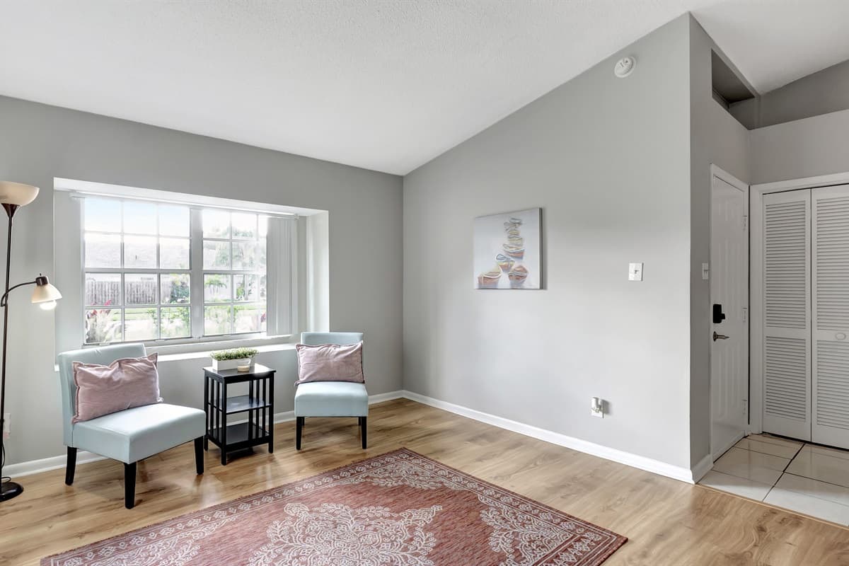 A charming extra seating nook nestled by the window.