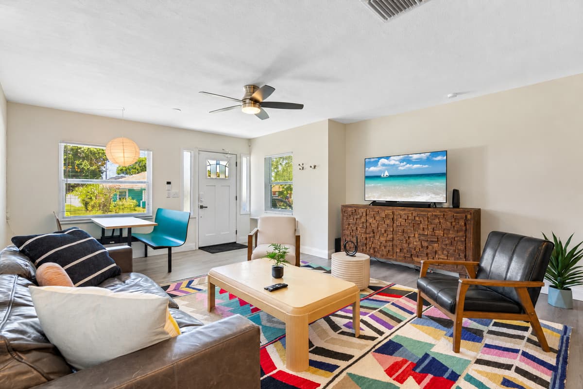 Spacious living room with a cozy couch where you and your family and friends can bond and relax. If you have any questions about this property, please don't hesitate to send us an inquiry.
