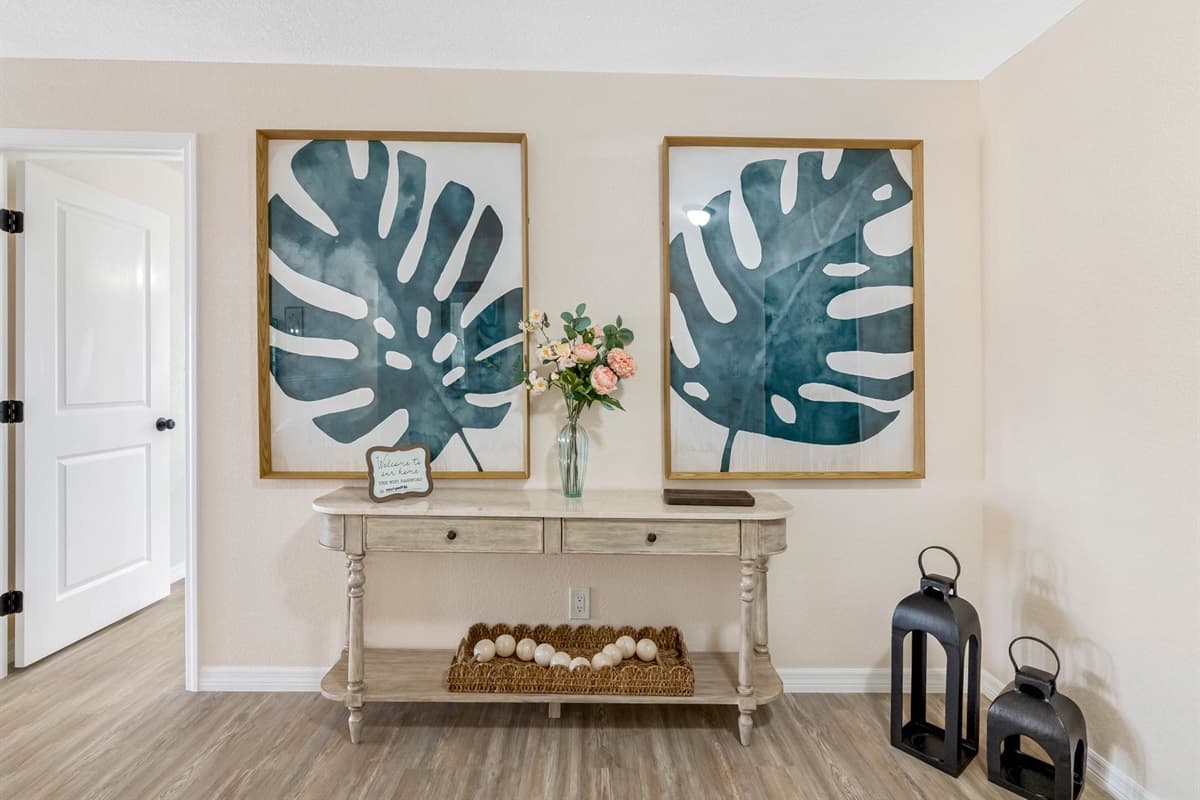 With neutral tones, soft textures, and beach-inspired décor, this living area offers a calm, coastal vibe.