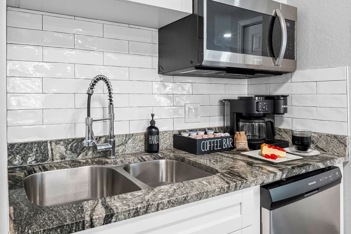 Enjoy the combination of sophisticated design and practical amenities in this modern kitchen space.