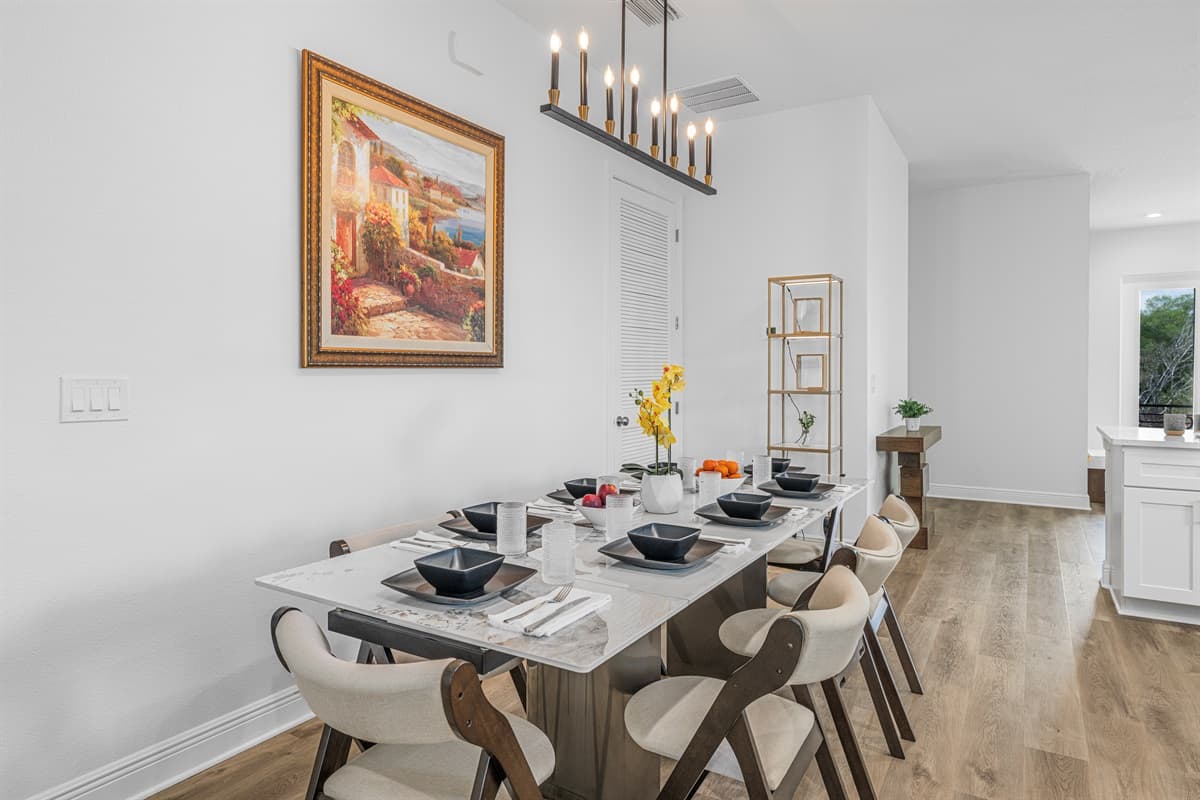 Elegant dining table setup with stylish décor and seating for multiple guests.