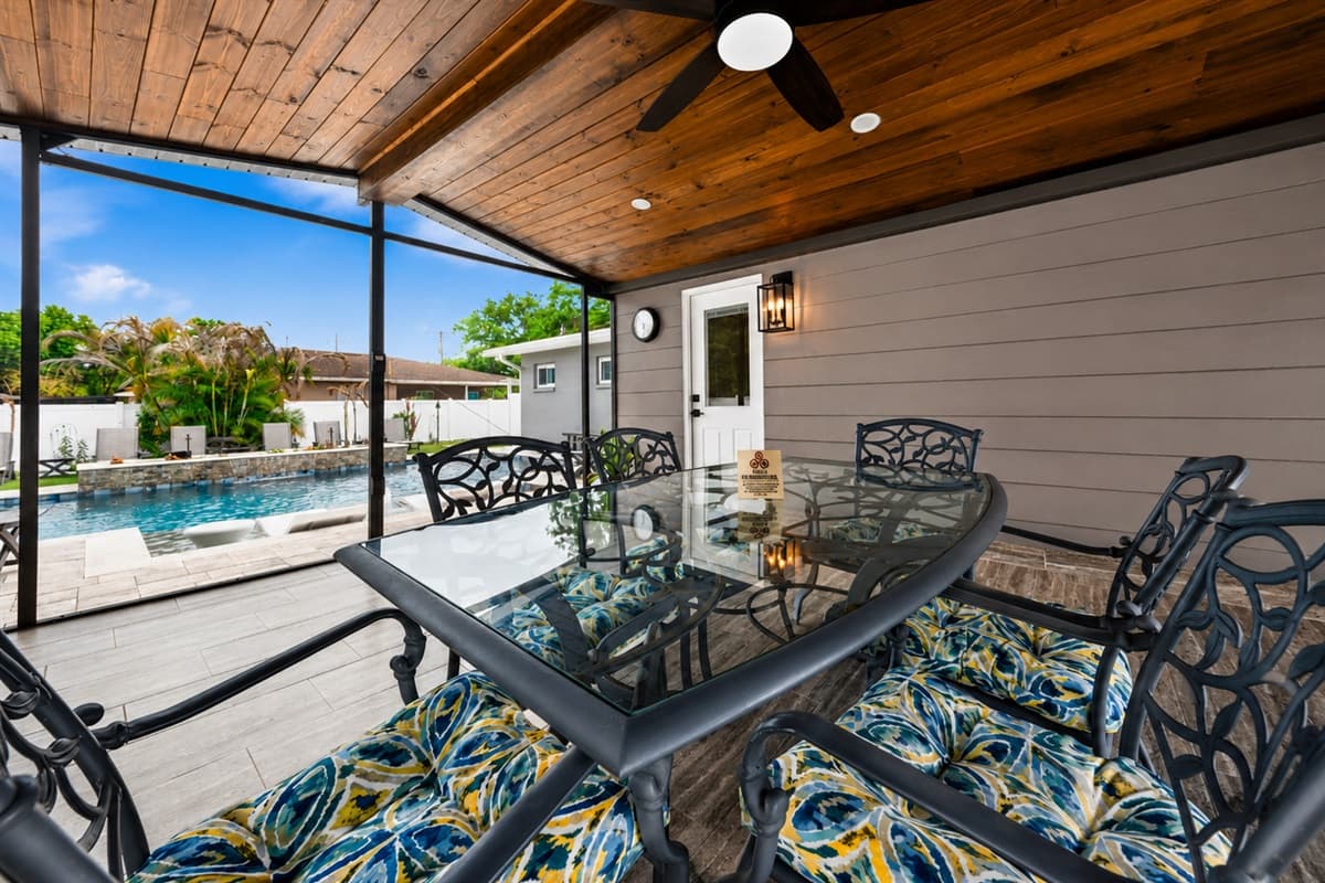 Elegant outdoor dining setup overlooking the private pool — perfect for morning coffee or evening meals.