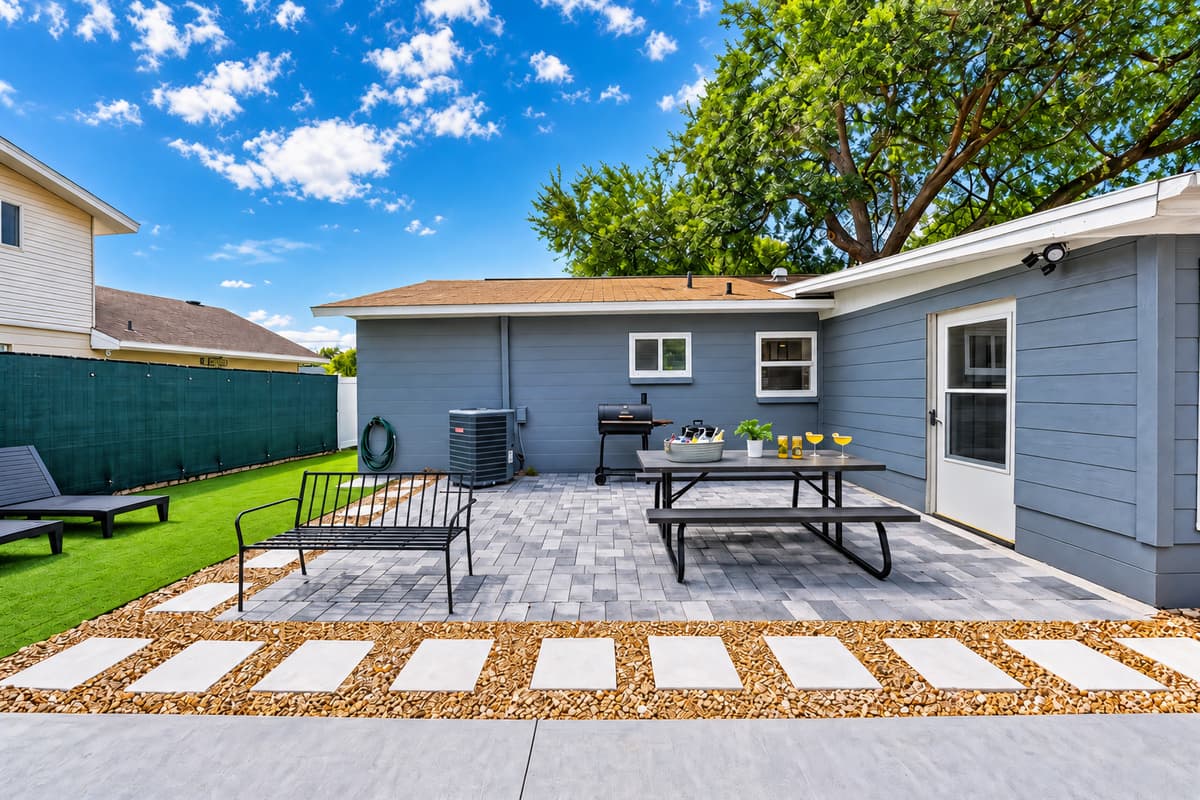 This modern grill and patio setup is primed for vibrant meals, intimate toasts, and unforgettable memories. Taste it!