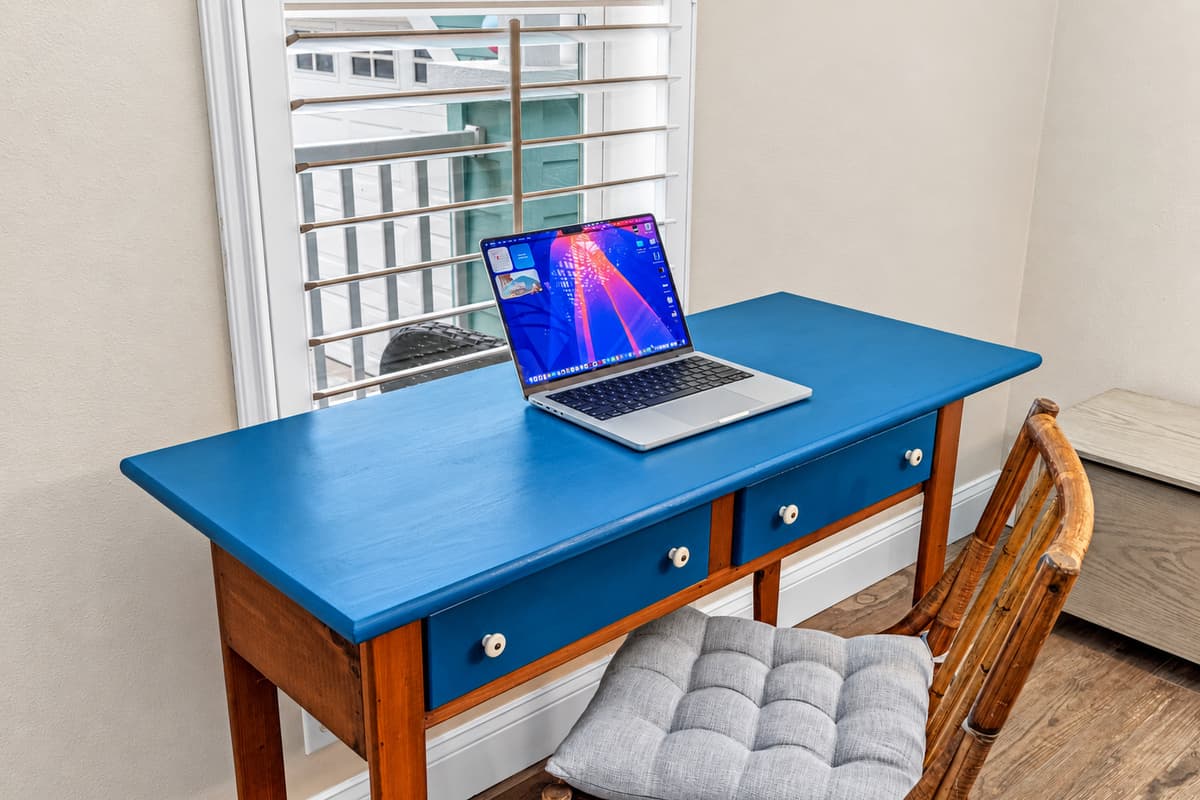 Need to catch up on emails or work remotely? This charming desk setup offers plenty of natural light, a comfortable chair, and a peaceful atmosphere ideal for productivity.