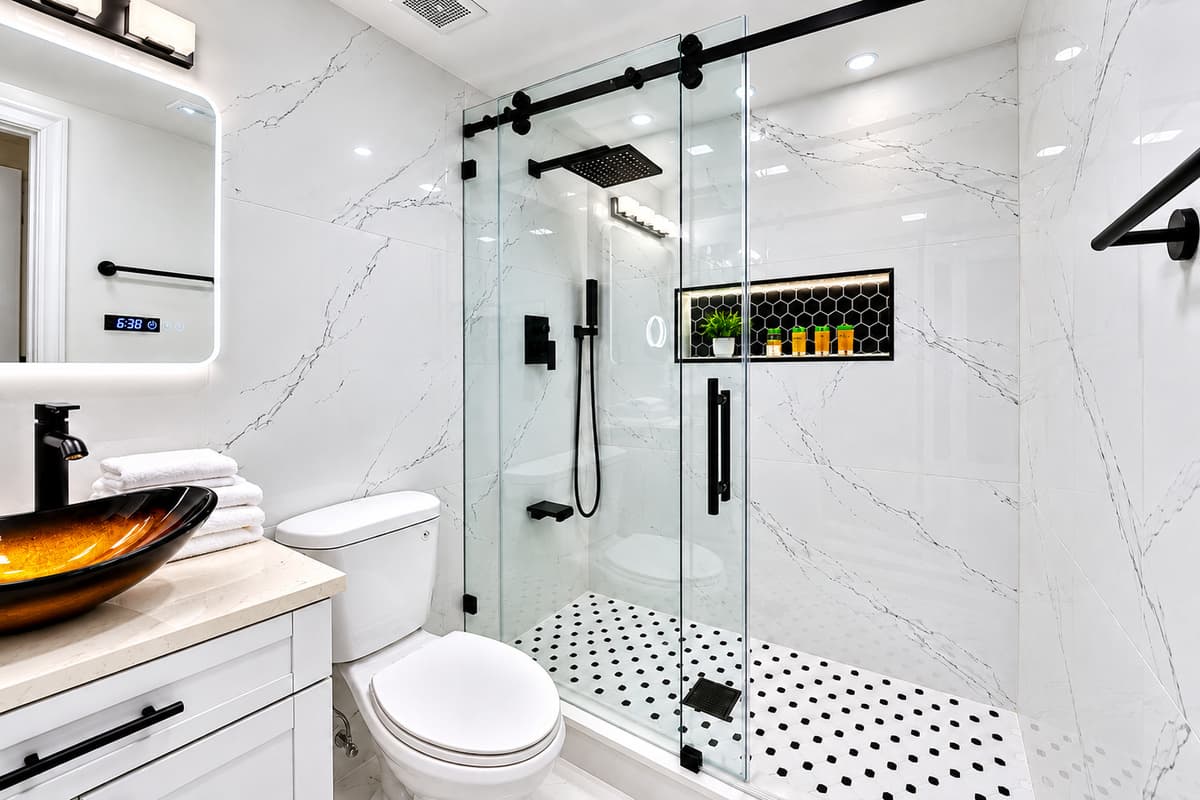 Bedroom 1 - Ensuite
Luxurious primary ensuite showcasing a large walk-in glass shower, modern fixtures, and beautifully updated finishes.