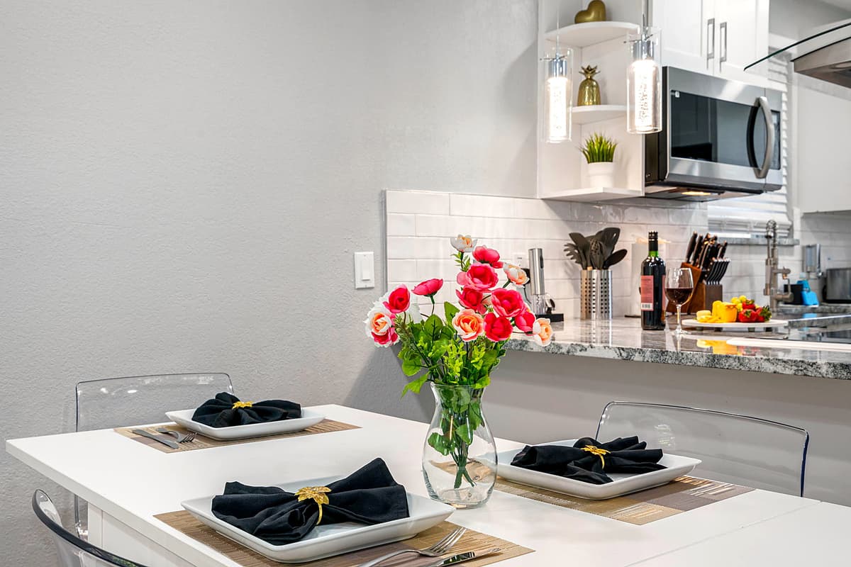 Just across from the kitchen, you'll find our inviting dining area, centered around a beautiful 4-seater dining table.