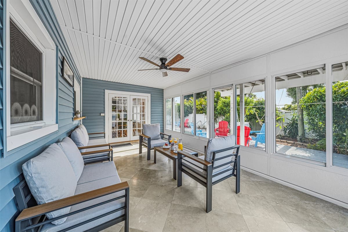 Stylish enclosed patio with comfortable lounge seating—perfect for morning coffee or evening relaxation 