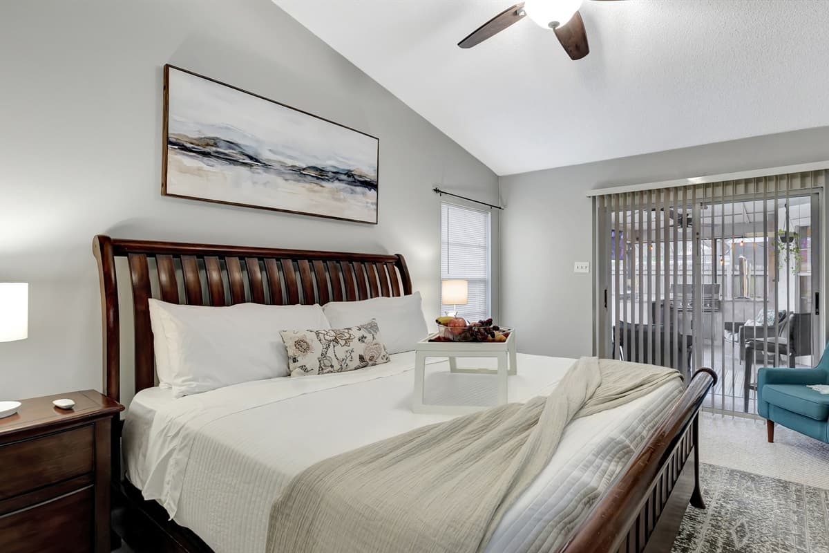 This master bedroom not only boasts a stylish en-suite bathroom but also grants seamless access to the inviting pool area.