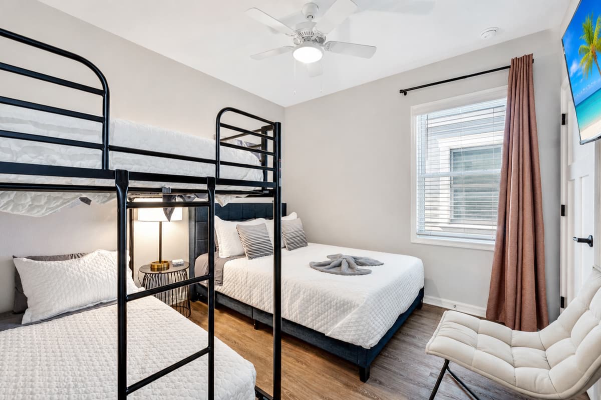 The bedroom is a symphony of tasteful decor and thoughtful furnishings, creating an ambiance that is both stylish and welcoming.