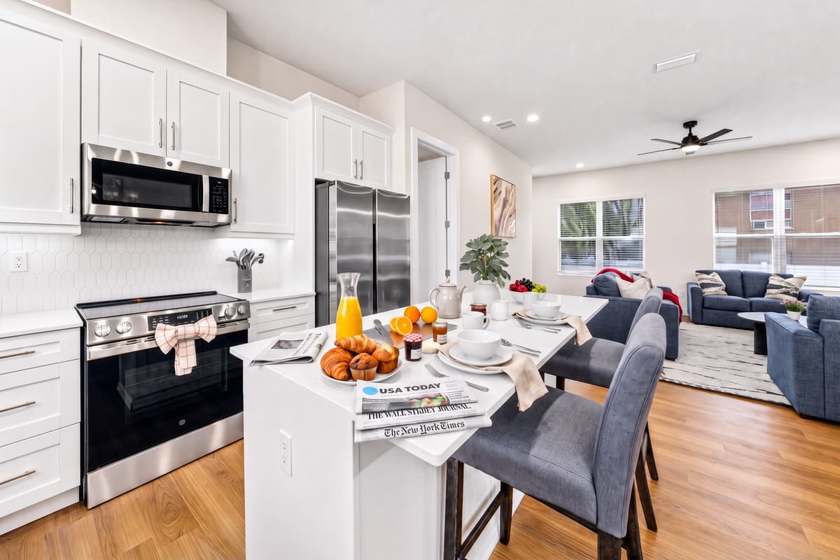 The open kitchen and dining layout keeps everyone connected, whether you're cooking or catching up.