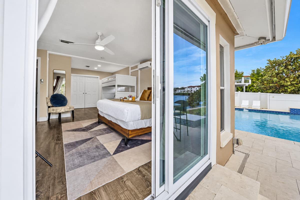 Step directly from the bedroom to the patio and enjoy peaceful waterfront views.
