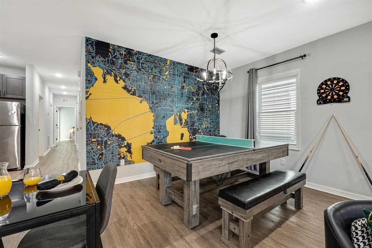 A vibrant space designed for entertainment and camaraderie, featuring a versatile convertible pool table and ping pong table.