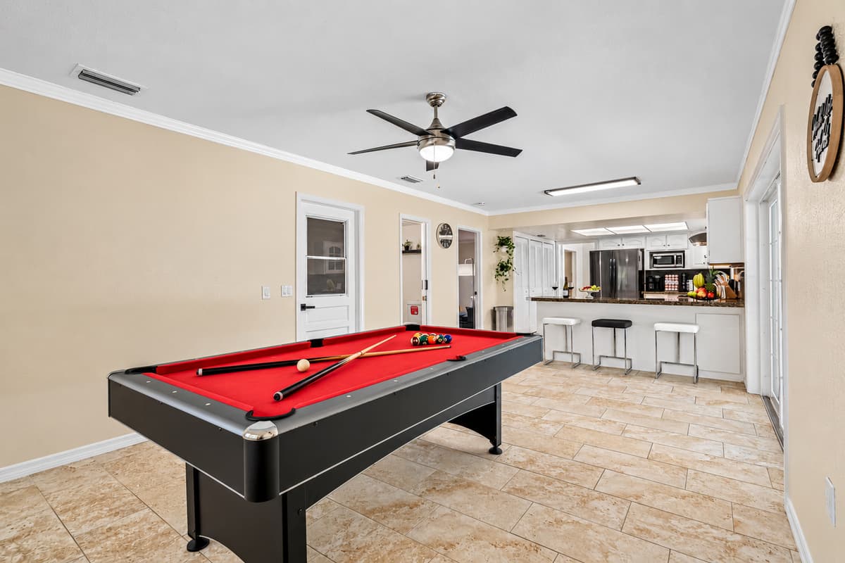 The centerpiece of this game room, a sleek and stylish pool table that's sure to impress.