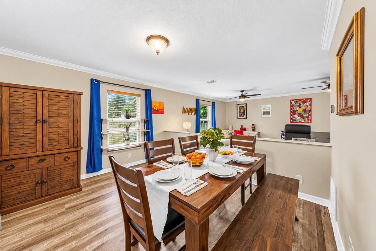 Large dining area with seating for the whole group, flowing seamlessly into the living space.