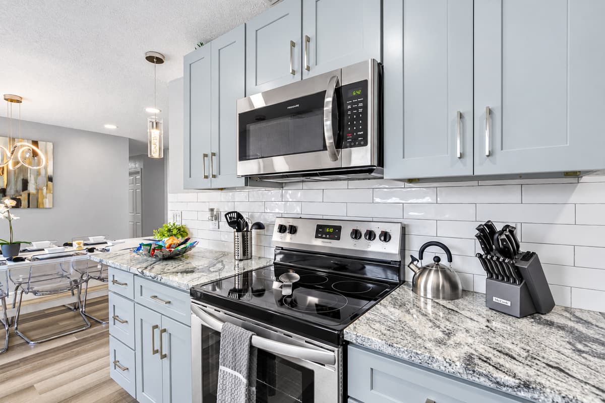 Everything you need to cook a real meal. Stainless electric range, microwave, kettle, and a full knife block within reach. Save on restaurant nights and cook a family dinner at home.