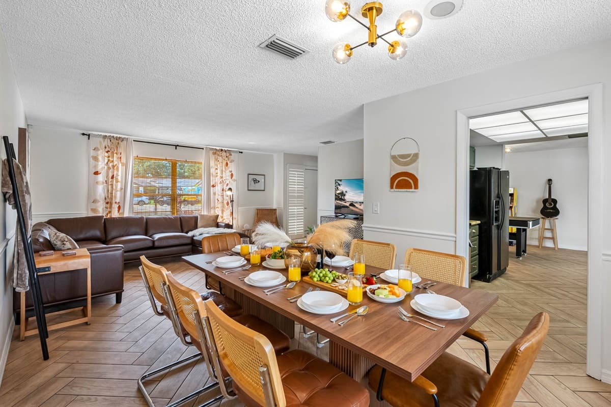This thoughtfully designed dining area combines natural textures, comfortable seating, and modern finishes—offering a polished yet approachable space for both everyday meals and special moments.