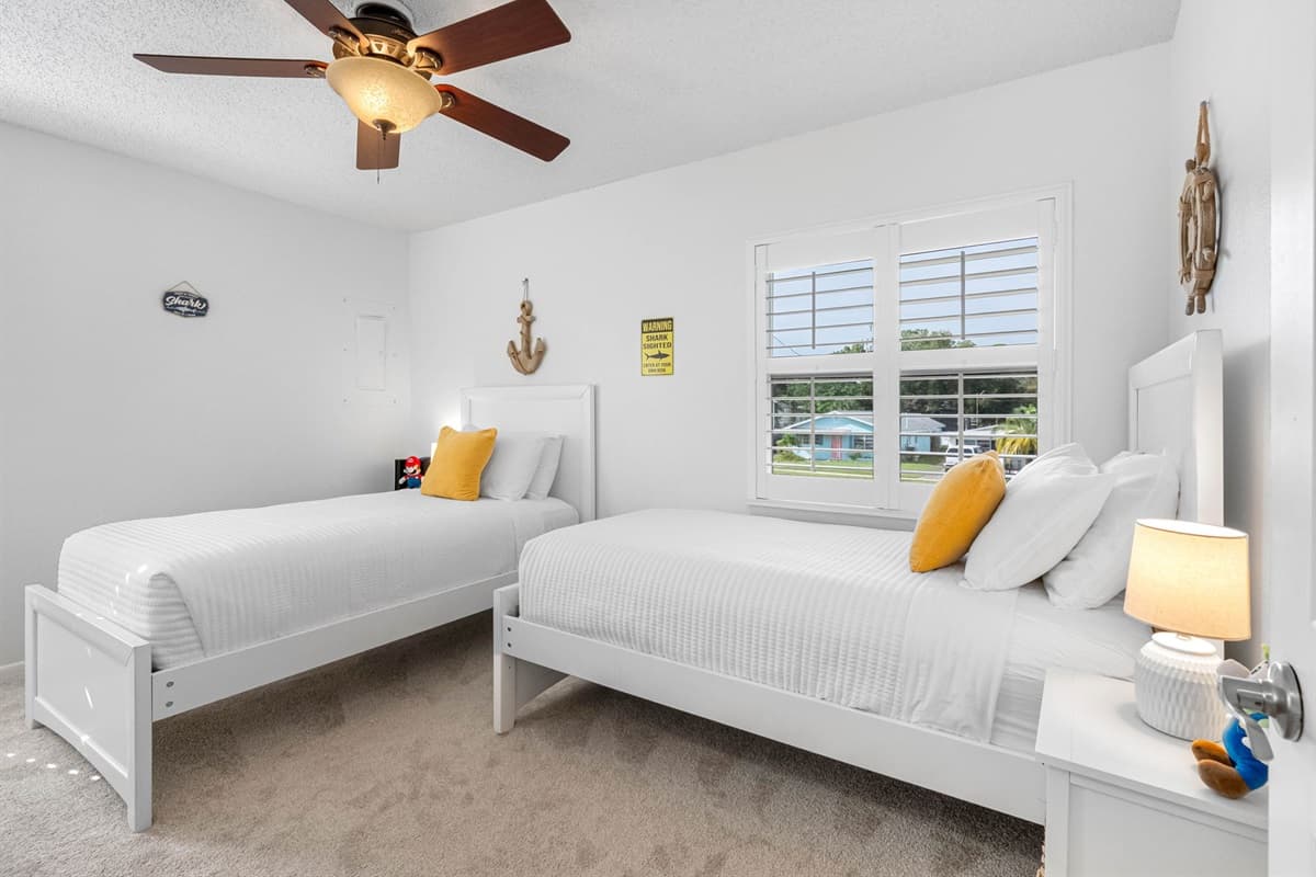 Perfect for kids or friends, this room features twin beds and cheerful décor.