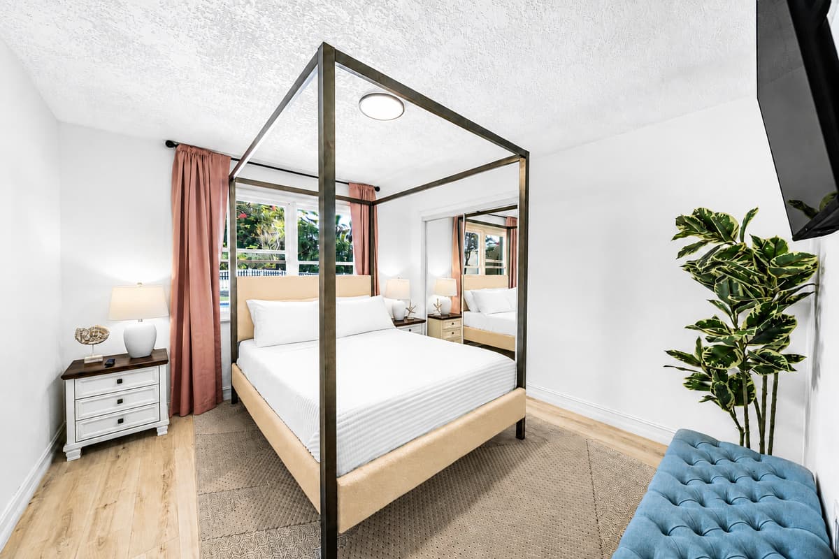 Windows on the side, lamp on the nightstand, floor space on both sides of the bed. Sleep in without apologizing.