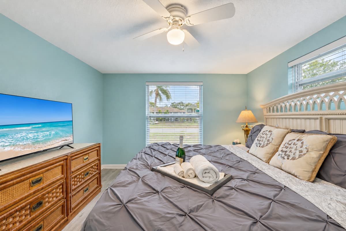 The true highlight of this room lies in its panoramic view of the waterfront canal.