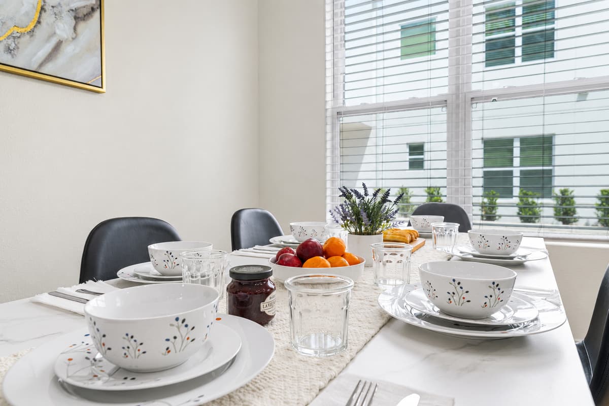 Enjoy breakfast at the dining table with views of the lush greenery just outside.
