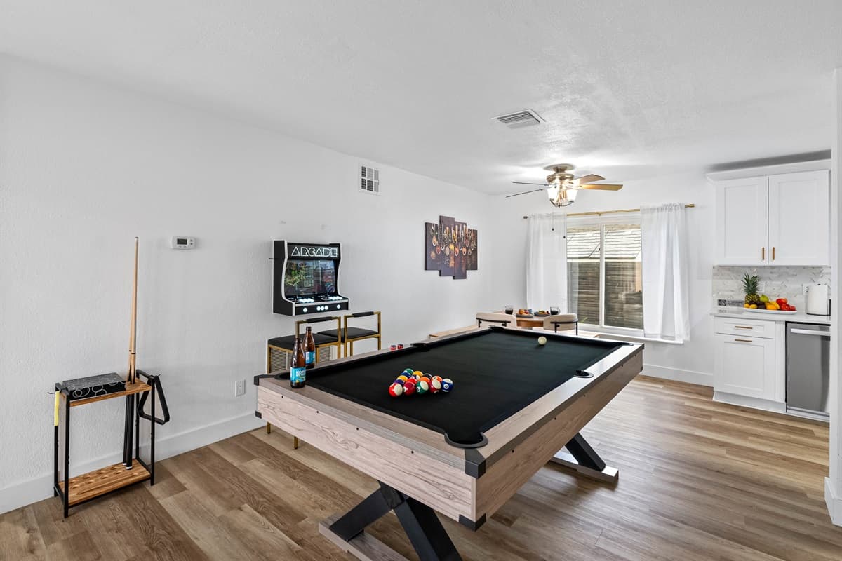 Your vacation just leveled up—this stylish game room is stocked with entertainment and ready for unforgettable memories.
