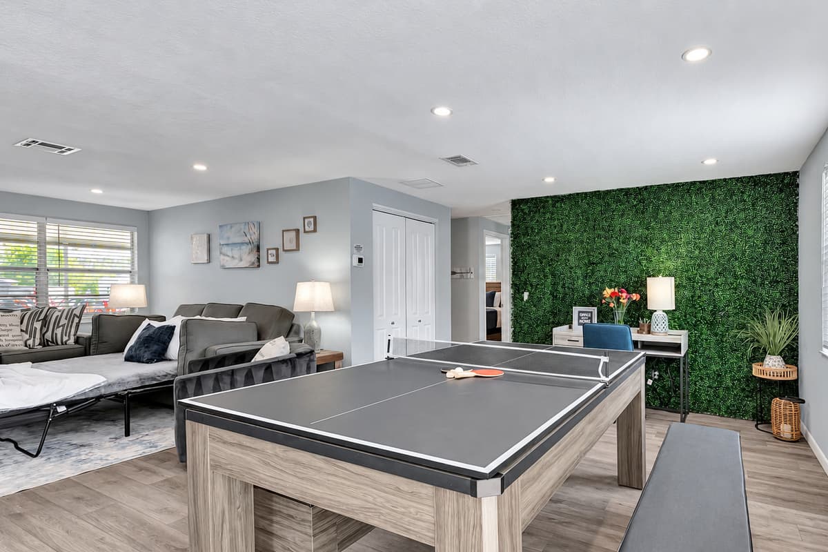 This table seamlessly transitions into a source of excitement, serving dual purposes as both a pool table and a ping pong table.