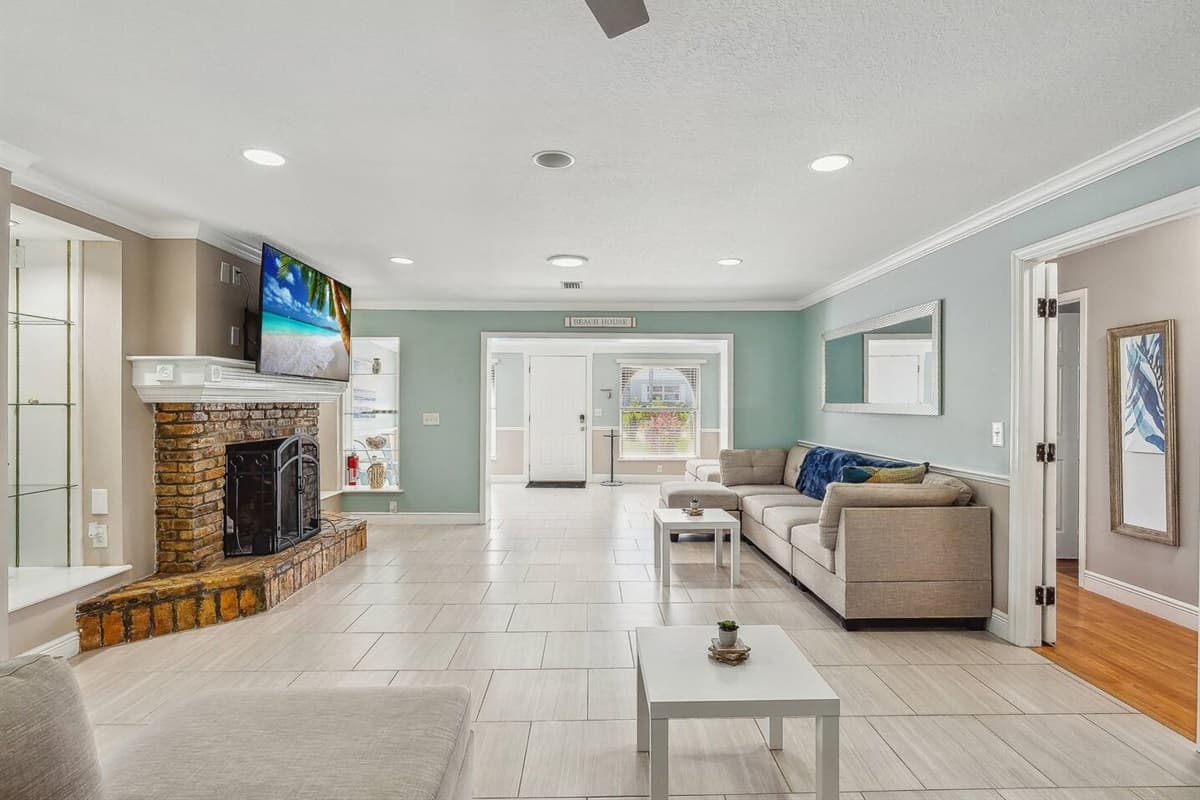 Living room with plenty of seating for the family and large UHD Smart TV