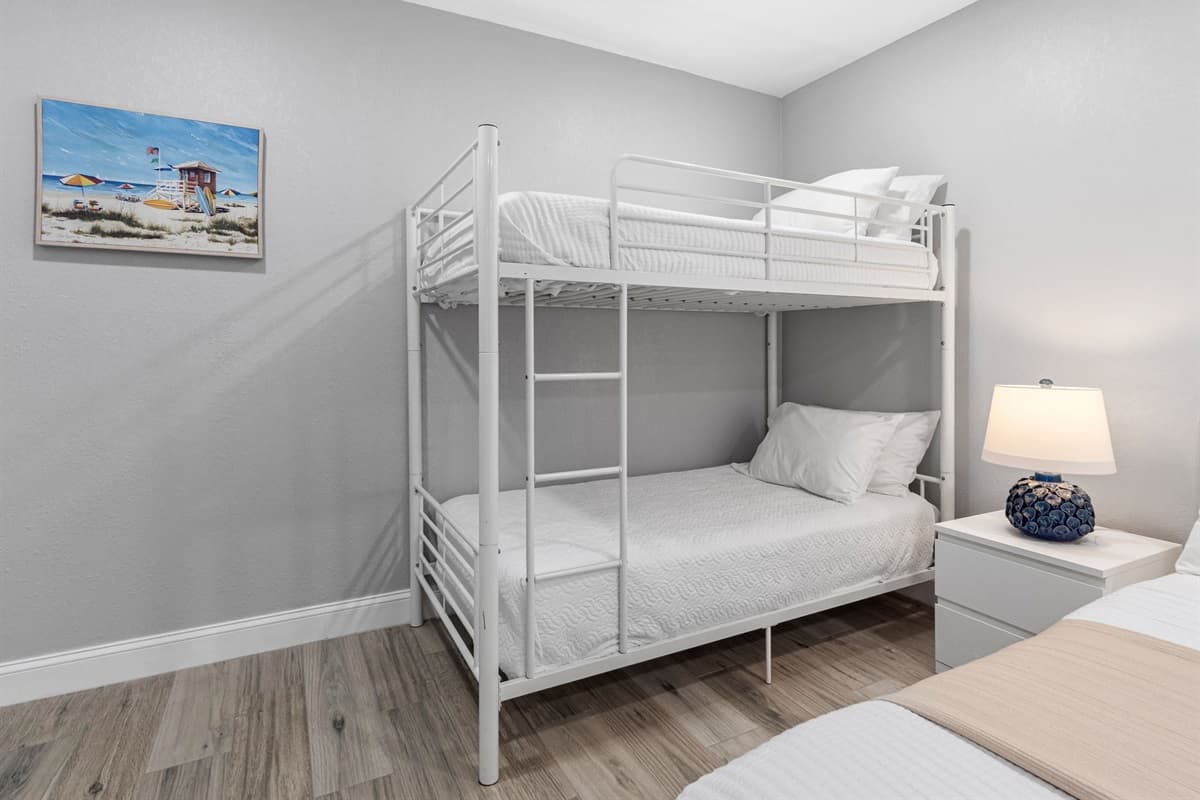 This thoughtfully designed room keeps the whole family close, offering both cozy king accommodations and fun bunk beds for the little ones