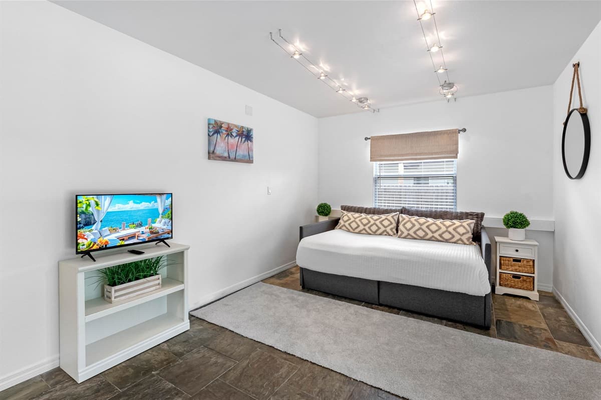 This bonus bedroom doubles as a game room — perfect for entertaining.