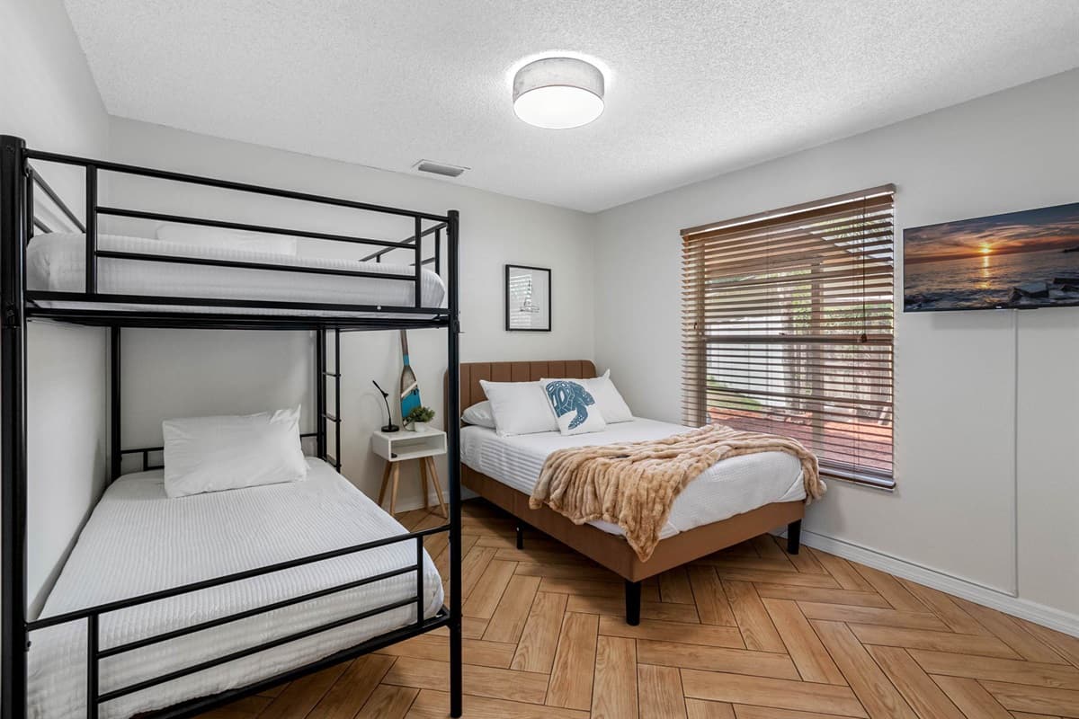 This bright, versatile room sleeps up to four with a full-size bed and a bunk. It’s fun, functional, and equipped with a smart TV for wind-down time.