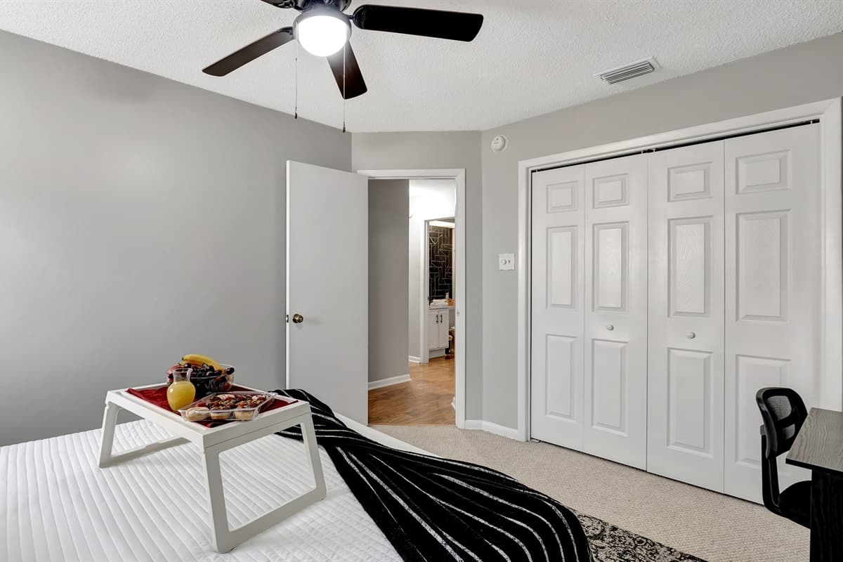 This inviting space boasts a generously spacious king-size bed adorned with cozy linens, creating a haven of relaxation.