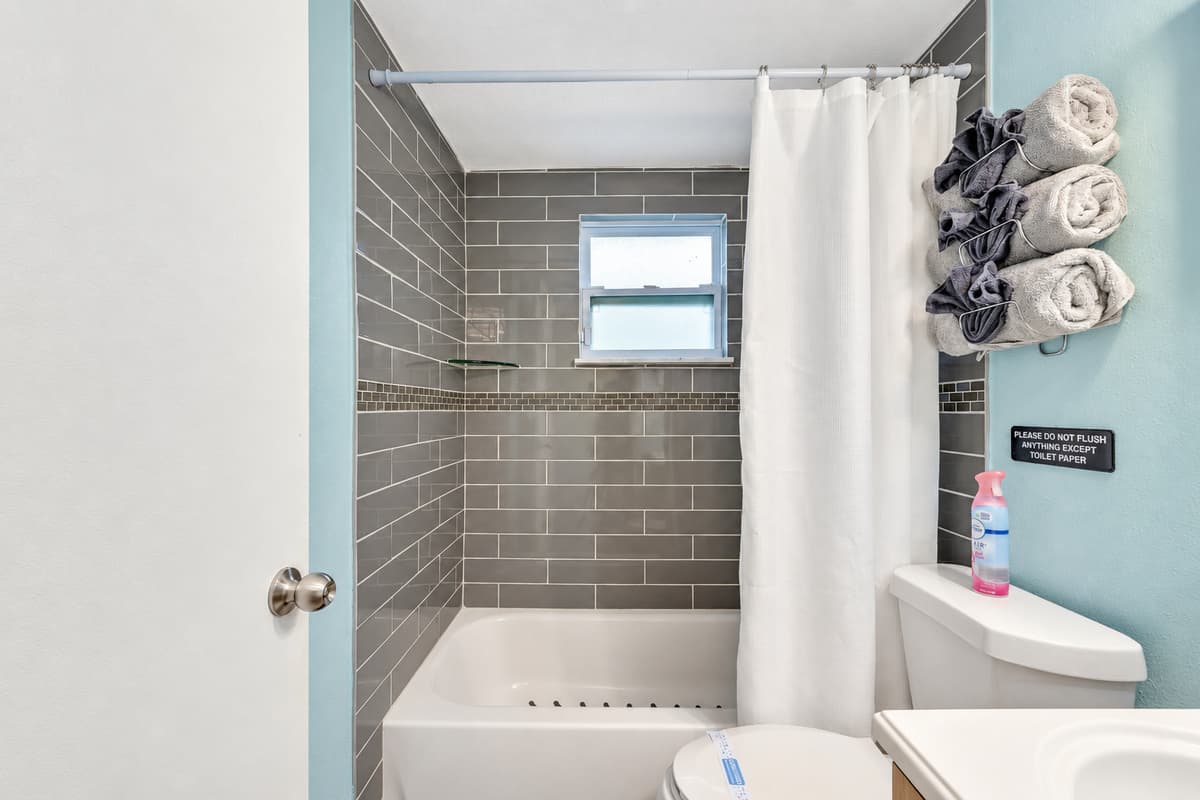 The thoughtful design of this pristine bathroom creates an ambiance that goes beyond mere functionality.