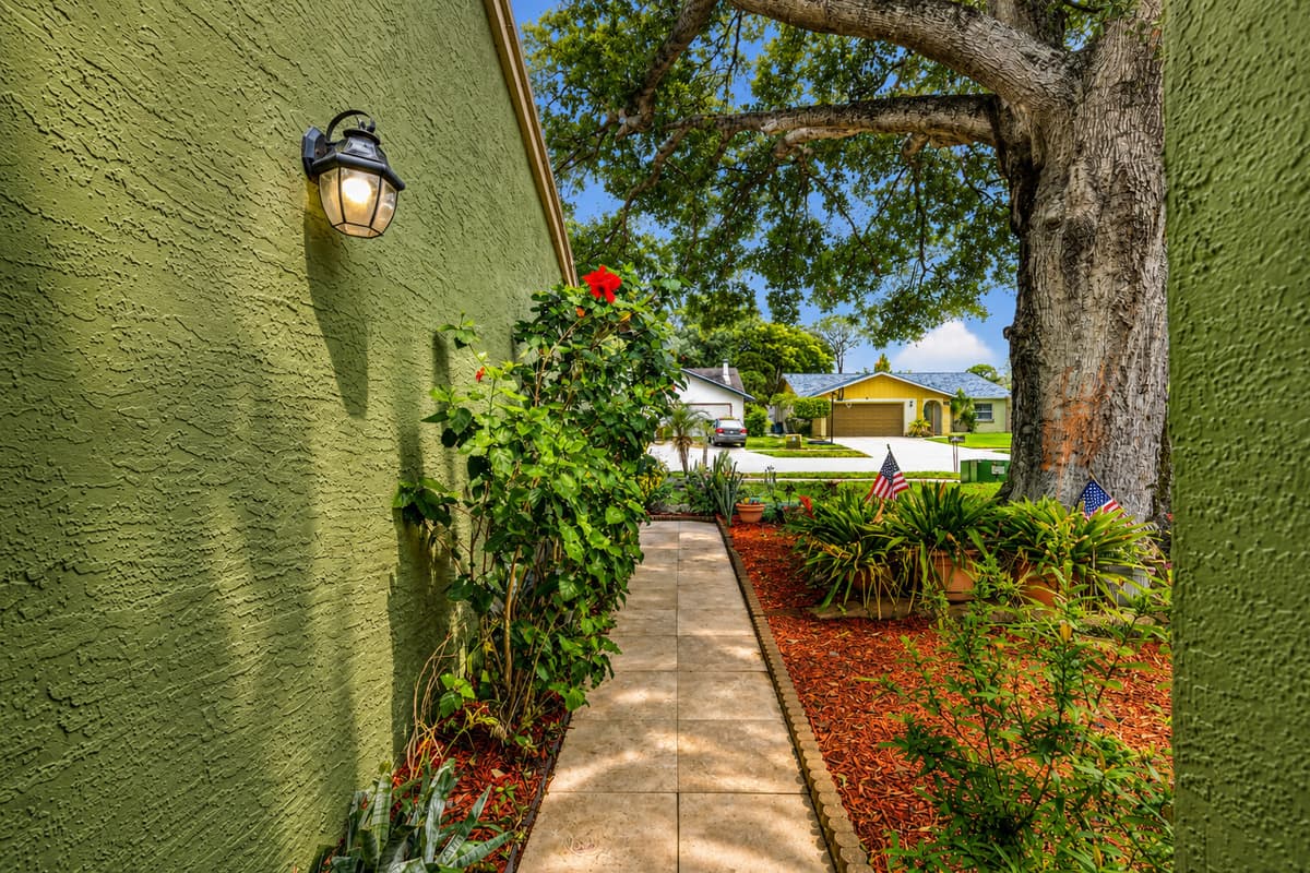 Peaceful garden path leading to the home's entrance, creating a warm first impression.