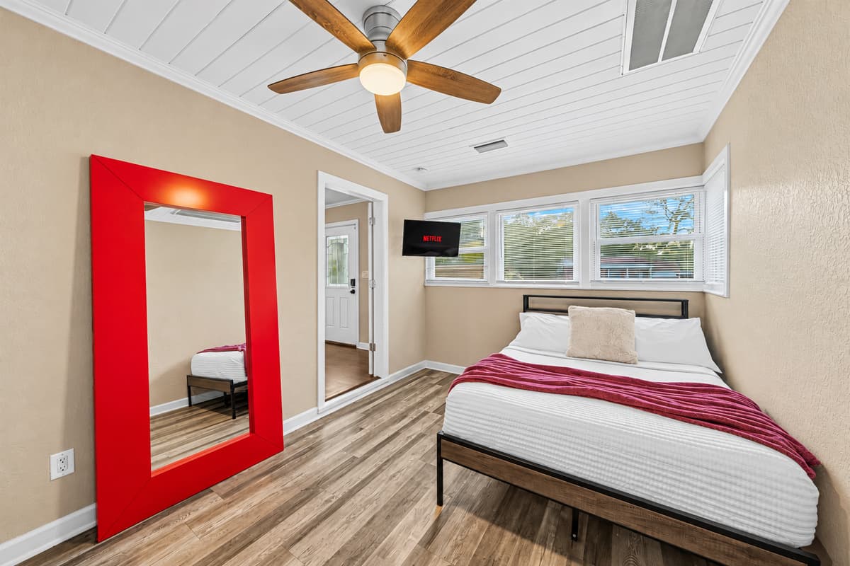 Comfortable bedroom with modern design, cozy bedding, and stylish accents.