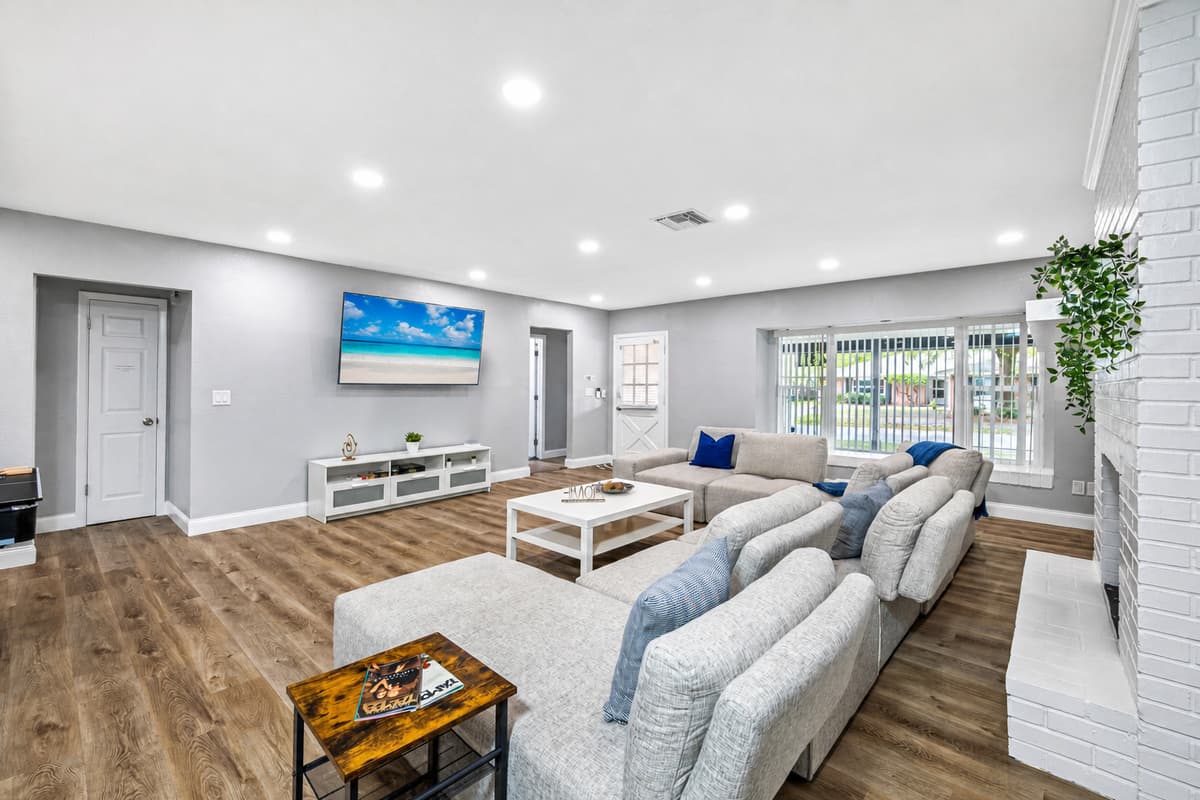 Gorgeous living room with L-Shaped comfortable couch where you could relax and enjoy watching on  our smart TV. have the best time during your stay with us! Please feel free to ask questions and send us an inquiry now!