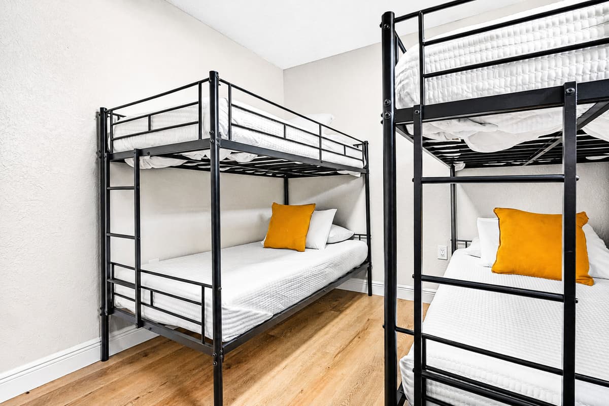 This lively room features two twin-over-twin bunk beds, providing comfortable sleeping arrangements for up to four guests.