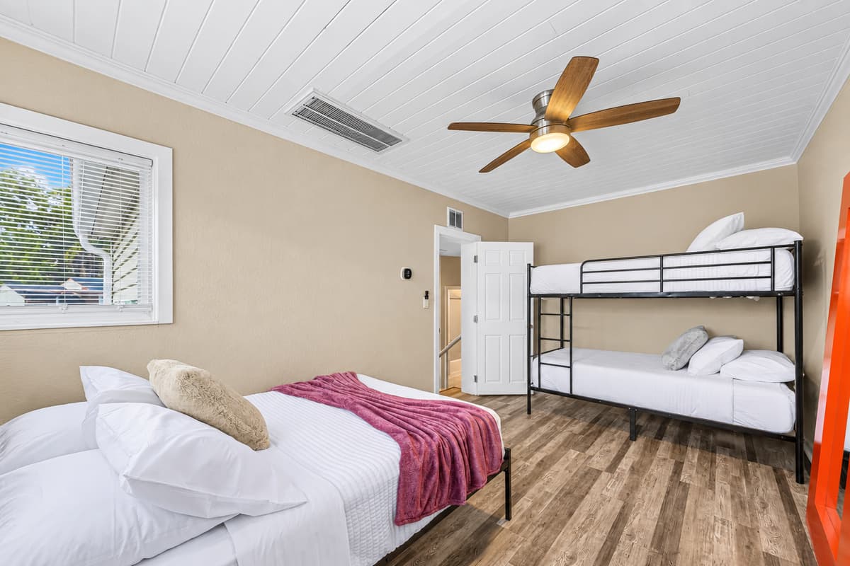 Spacious bunk room with multiple beds—ideal for families, kids, or group stays.