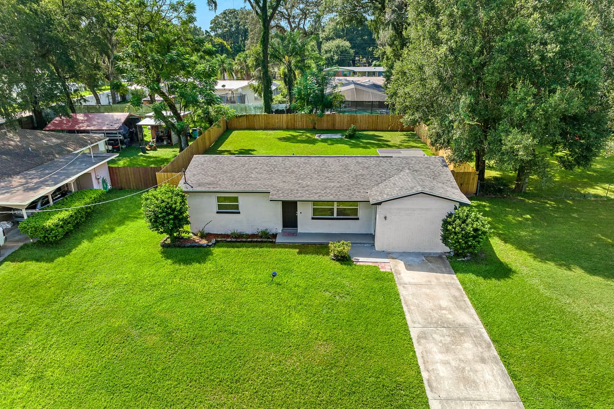 Breathtaking aerial front view of our eautiful property and the safe and wonderful neighborhood. Enjoy the view outside showcasing beautiful properties in the area. Book this property now!