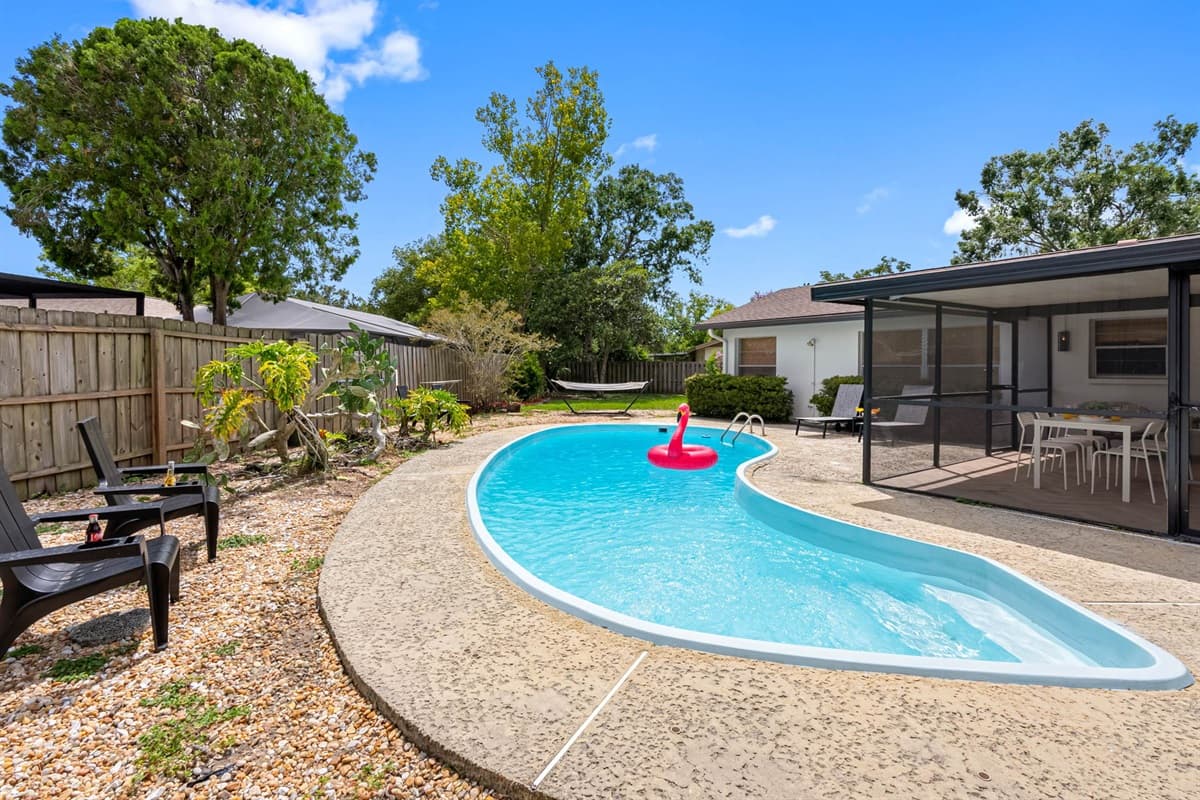 Stretch out on a sleek poolside lounger and soak up the Florida rays. This backyard retreat offers the perfect balance of shade, sun, and chill.