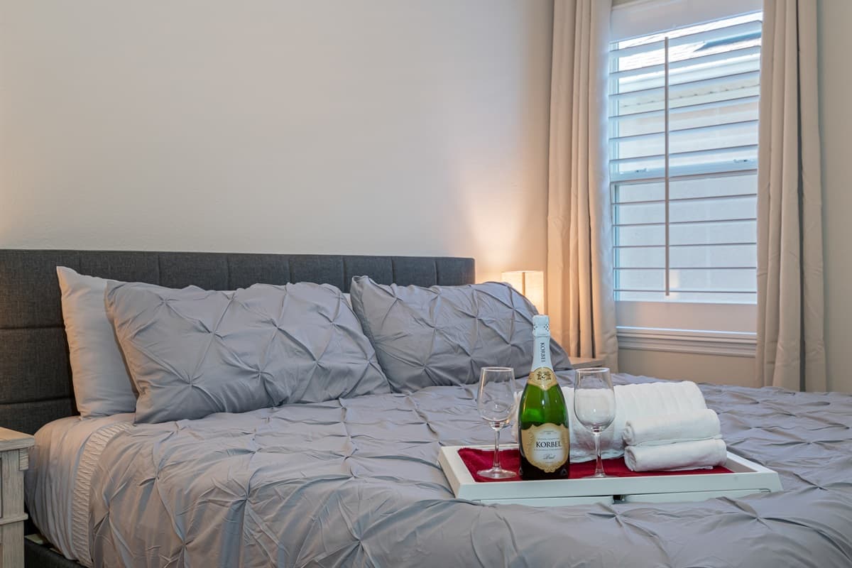 Lovely bedroom that has comfy king sized bed, night stand, drawers for storage and smart TV. Sleep safe and sound during your stay this wonderful house! If you like this property, send us an inquiry now!