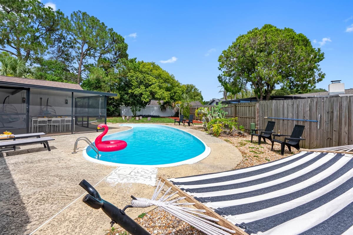 Start your mornings poolside with coffee and end the day with a sunset dip. The fully fenced backyard offers privacy, while loungers and chairs provide plenty of room to relax in style.