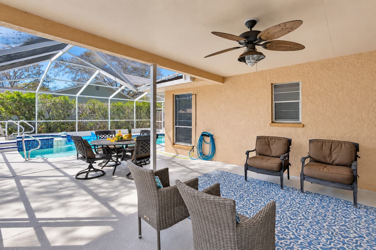 With ceiling fans to keep the air moving and the full enclosure offering shade and protection, the space remains inviting even during the warmer parts of the day.