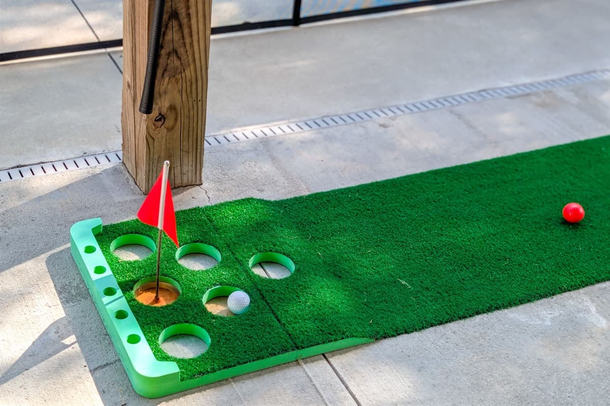 Challenge friends to mini-golf or cornhole steps away from the pool.