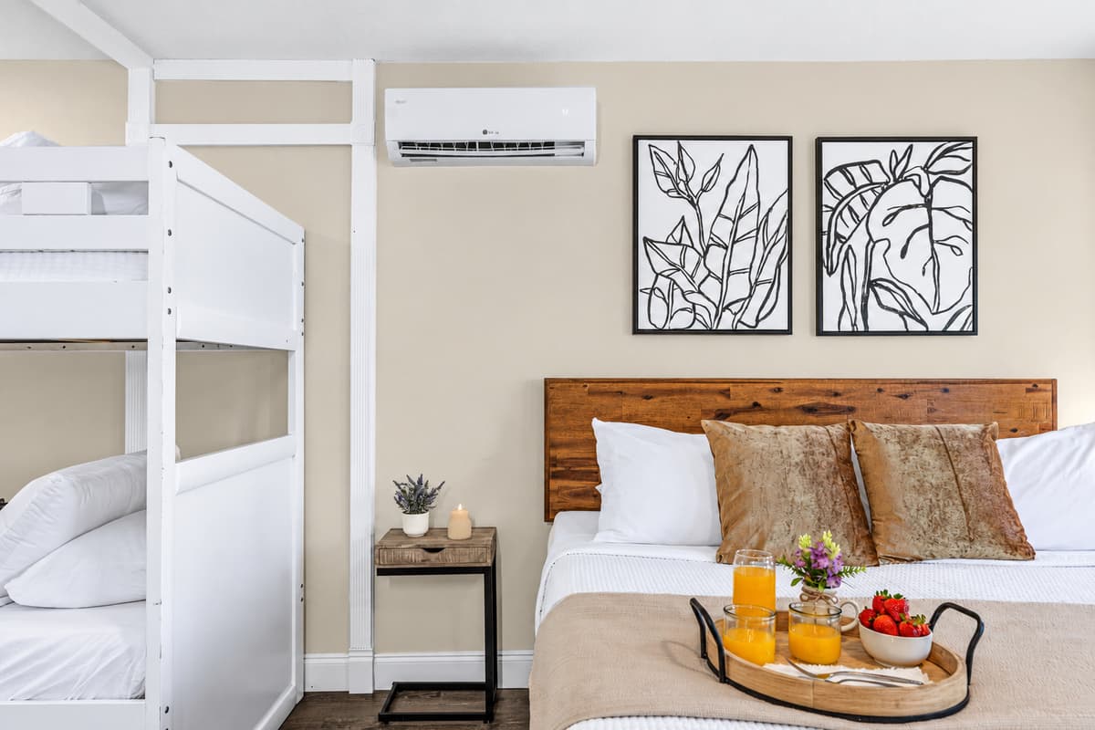 Family-friendly bedroom with a king bed and built-in twin bunk beds.