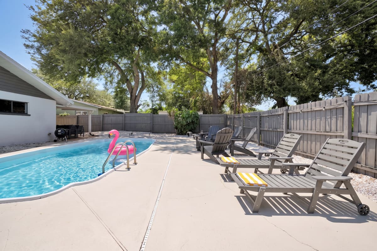 The yard is fully fenced on every side, so the pool area stays private and contained. Parents can sit down and actually relax, the dog gets to run, and nobody has to watch the gate or the street for the entire week.