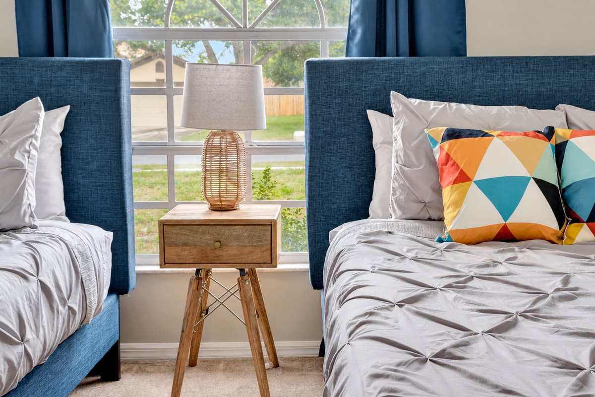 As the morning sun pours through the expansive window, it illuminates the room with a warm and welcoming glow.