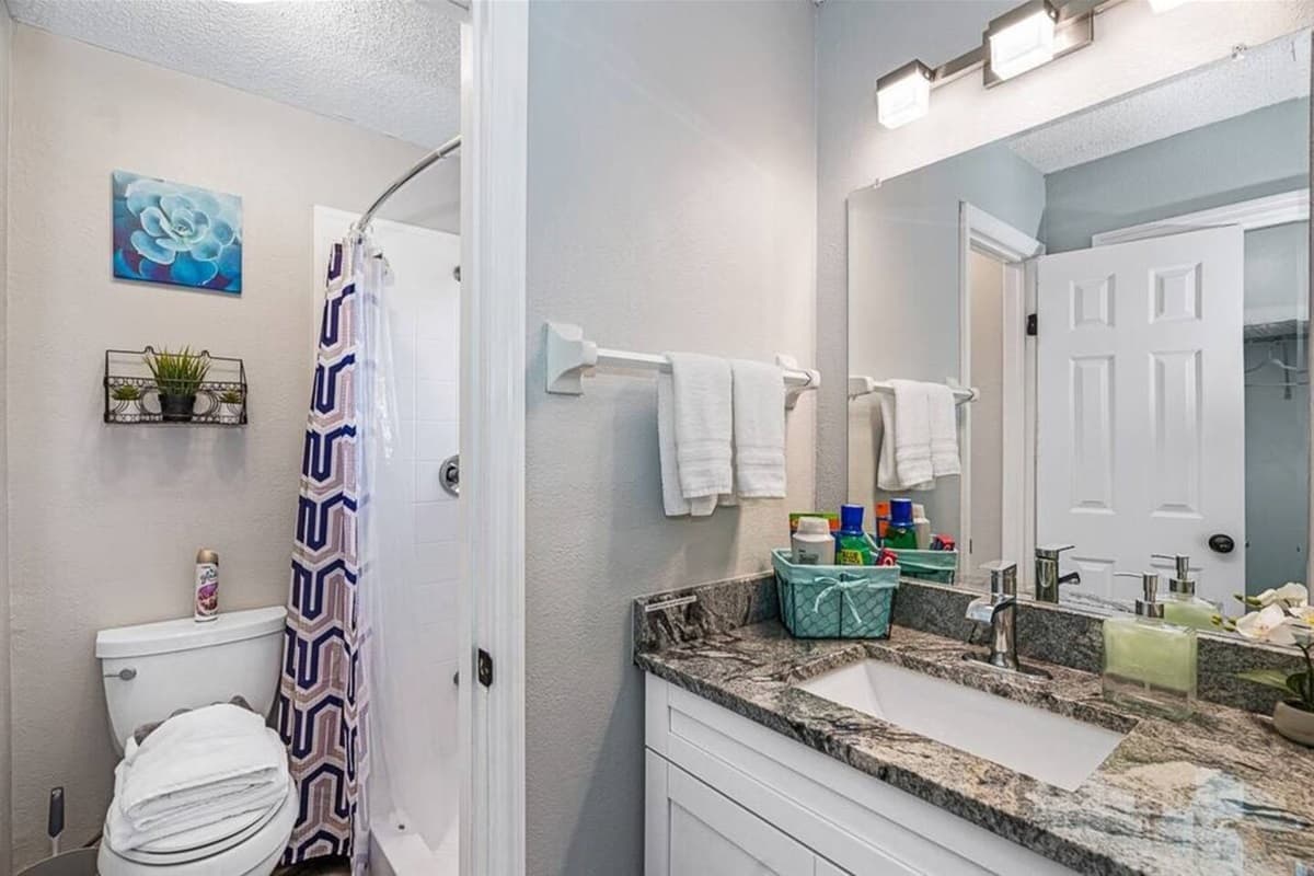 A beautiful bathroom that has a beautiful sink, vanity mirror, walk-in shower and toilet. Don't we all love a clean bathroom that has enough space for us to move around? If you are interested in this property, send us an inquiry now!