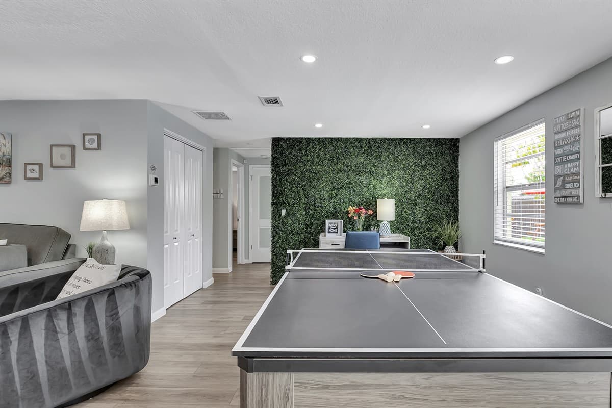 The spacious dining table, designed for eight, seamlessly morphs into your choice of a thrilling pool table or a lively pingpong table.