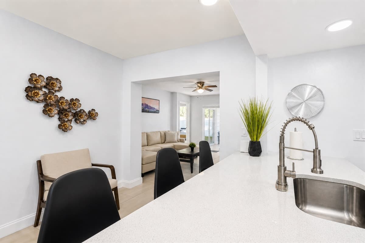 Bright and modern kitchen with stylish décor, bar seating, and spacious counters.